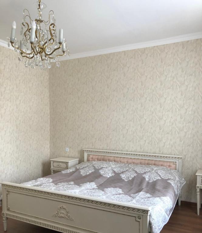 Postel nebo postele na pokoji v ubytování Lia Khaikashvili Guest House