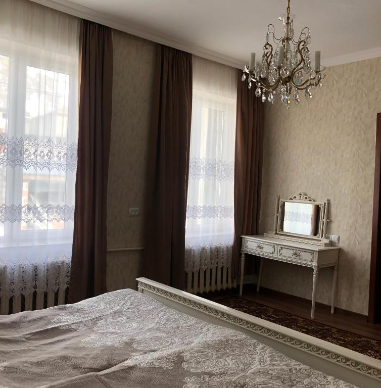 Postel nebo postele na pokoji v ubytování Lia Khaikashvili Guest House