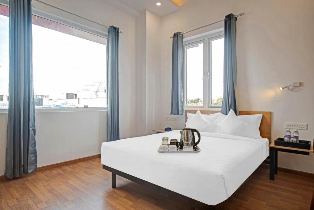 Postel nebo postele na pokoji v ubytování UPAR Hotels - T Nagar