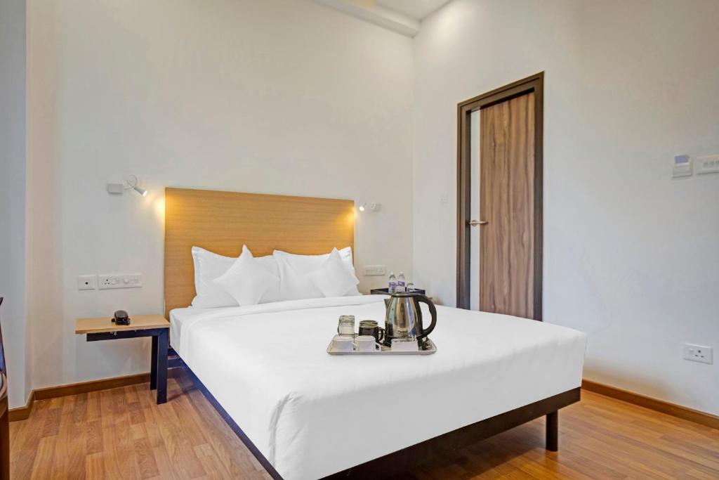 Postel nebo postele na pokoji v ubytování UPAR Hotels - T Nagar