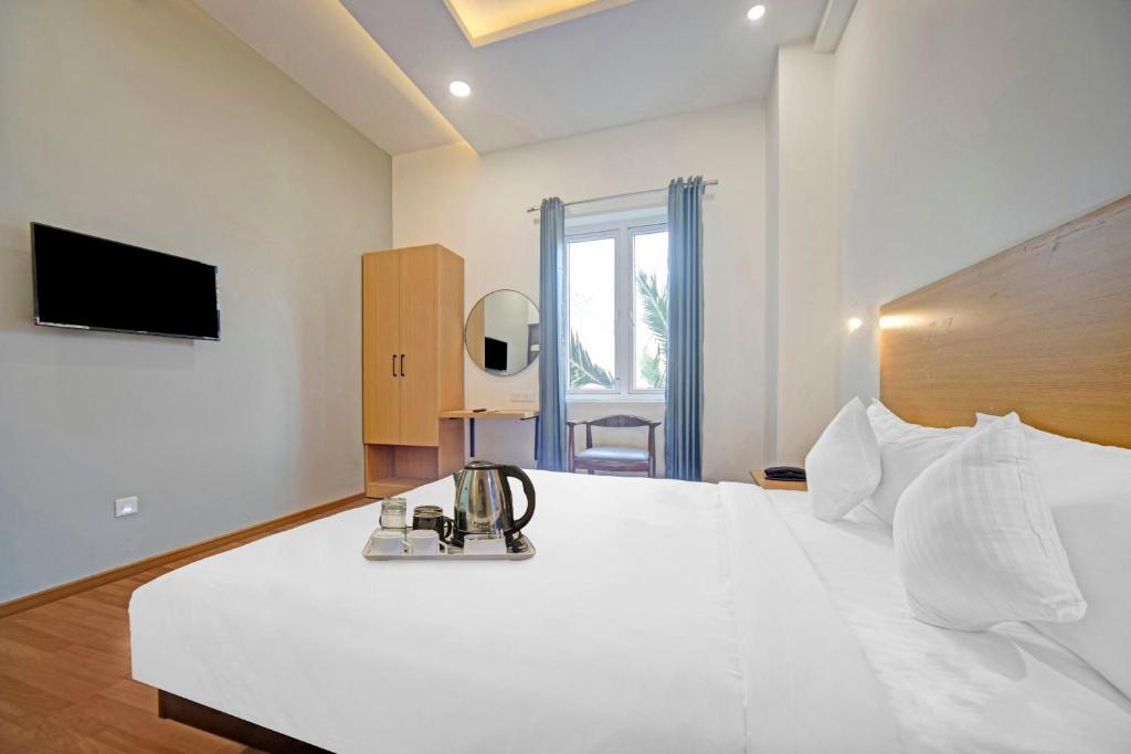 TV a/nebo společenská místnost v ubytování UPAR Hotels - T Nagar