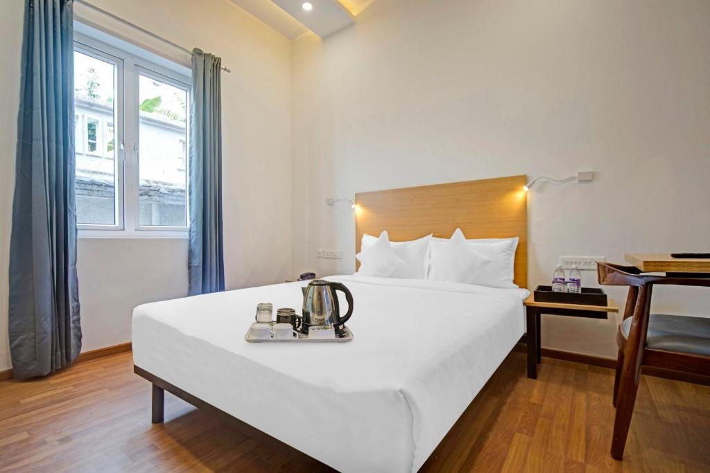 Postel nebo postele na pokoji v ubytování UPAR Hotels - T Nagar
