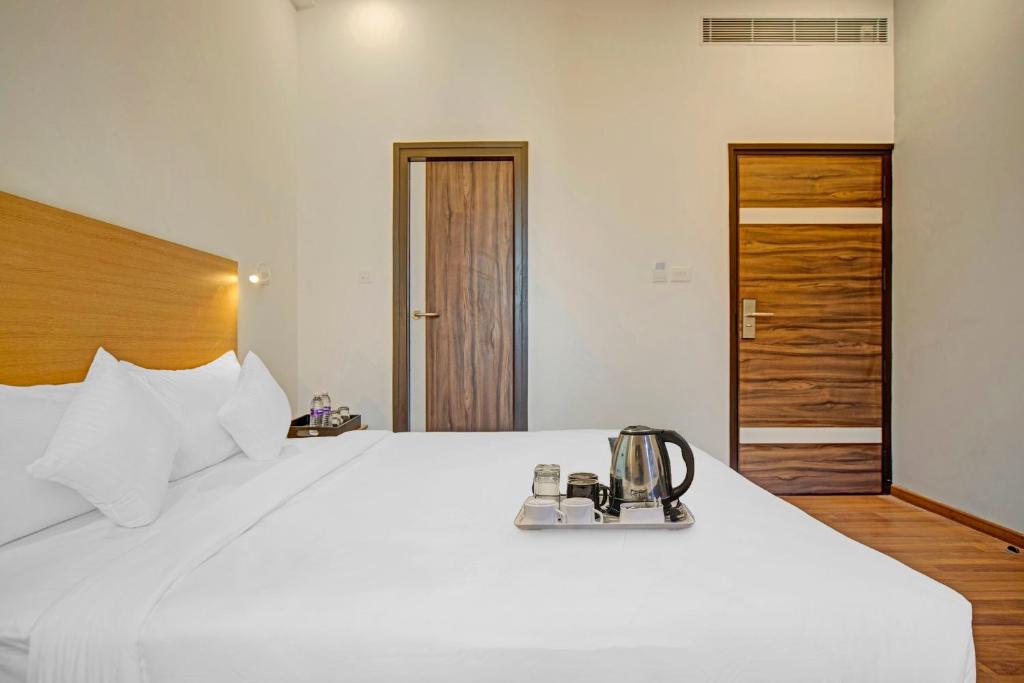 Postel nebo postele na pokoji v ubytování UPAR Hotels - T Nagar
