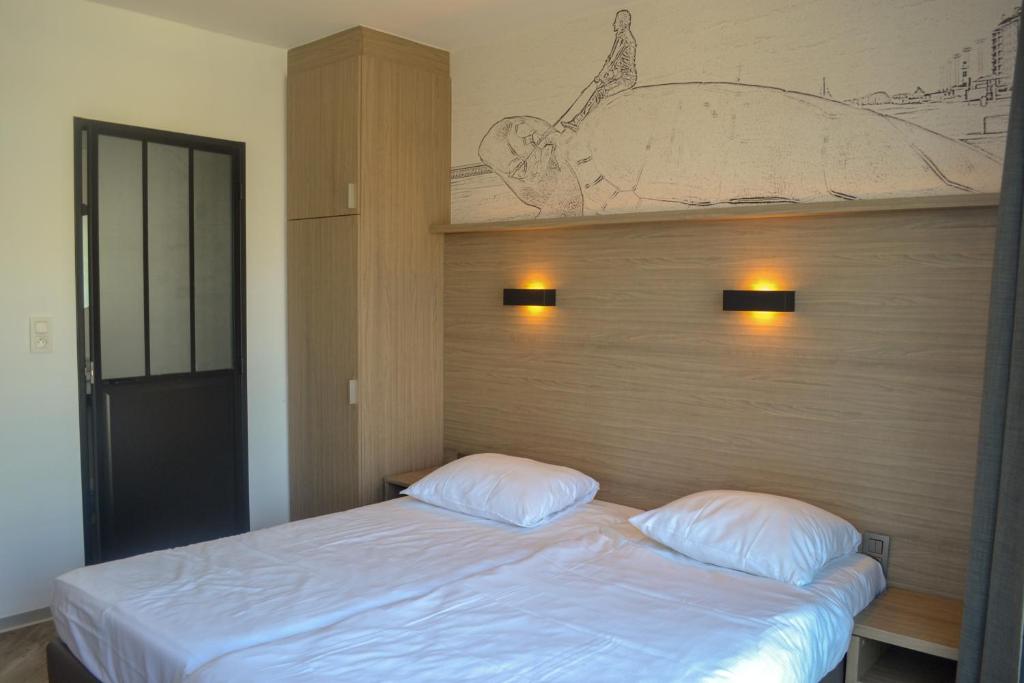 Postel nebo postele na pokoji v ubytování Hotel Sandeshoved Zeedijk