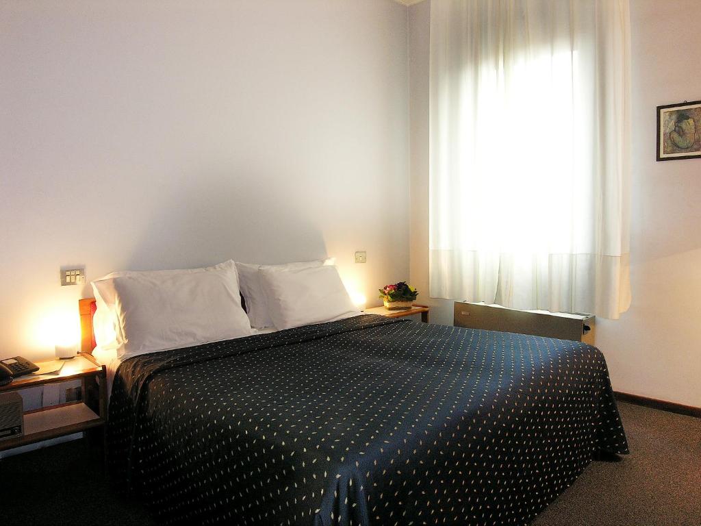 Postel nebo postele na pokoji v ubytování Hotel Al Cason