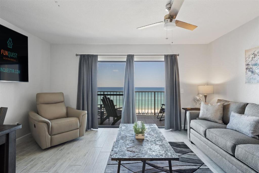 a living room with a view of the ocean at The Summit 621 in Panama City Beach