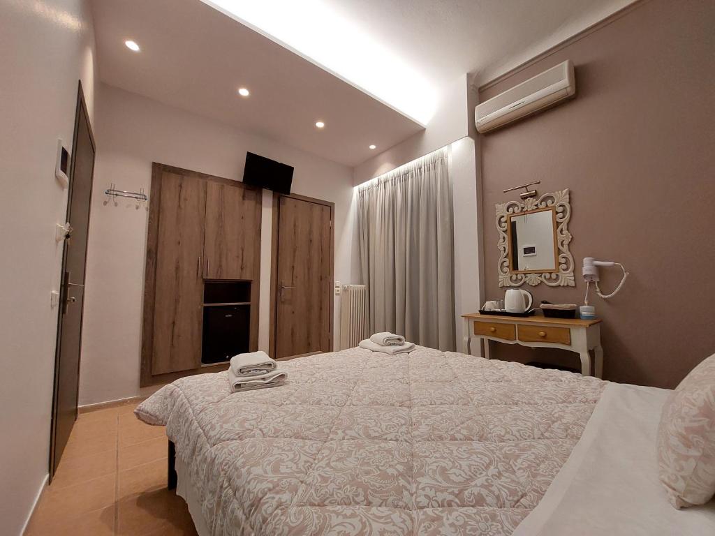 Postel nebo postele na pokoji v ubytování Hotel Akti