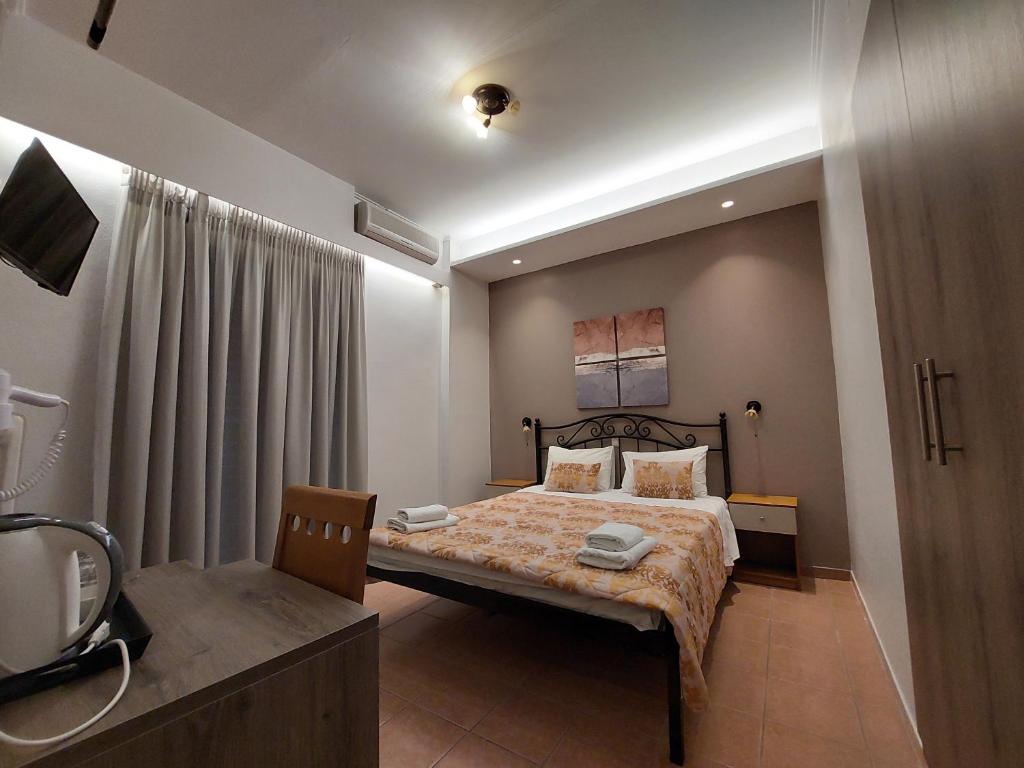 Postel nebo postele na pokoji v ubytování Hotel Akti