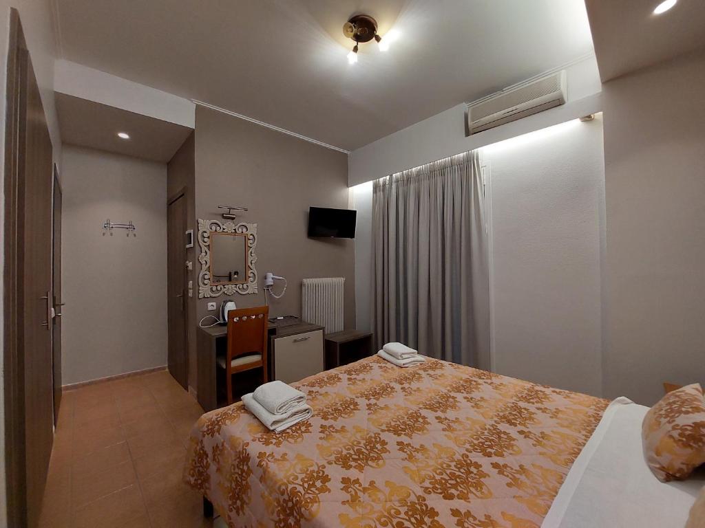 Postel nebo postele na pokoji v ubytování Hotel Akti