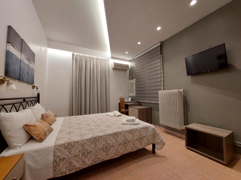 Postel nebo postele na pokoji v ubytování Hotel Akti