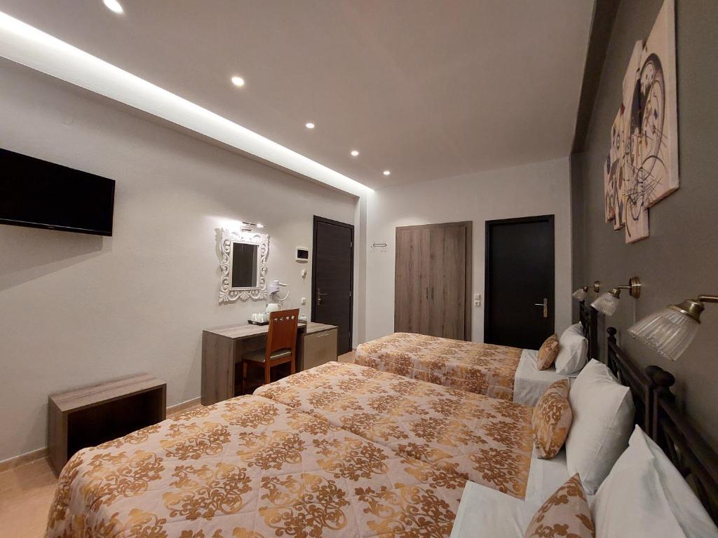 Postel nebo postele na pokoji v ubytování Hotel Akti