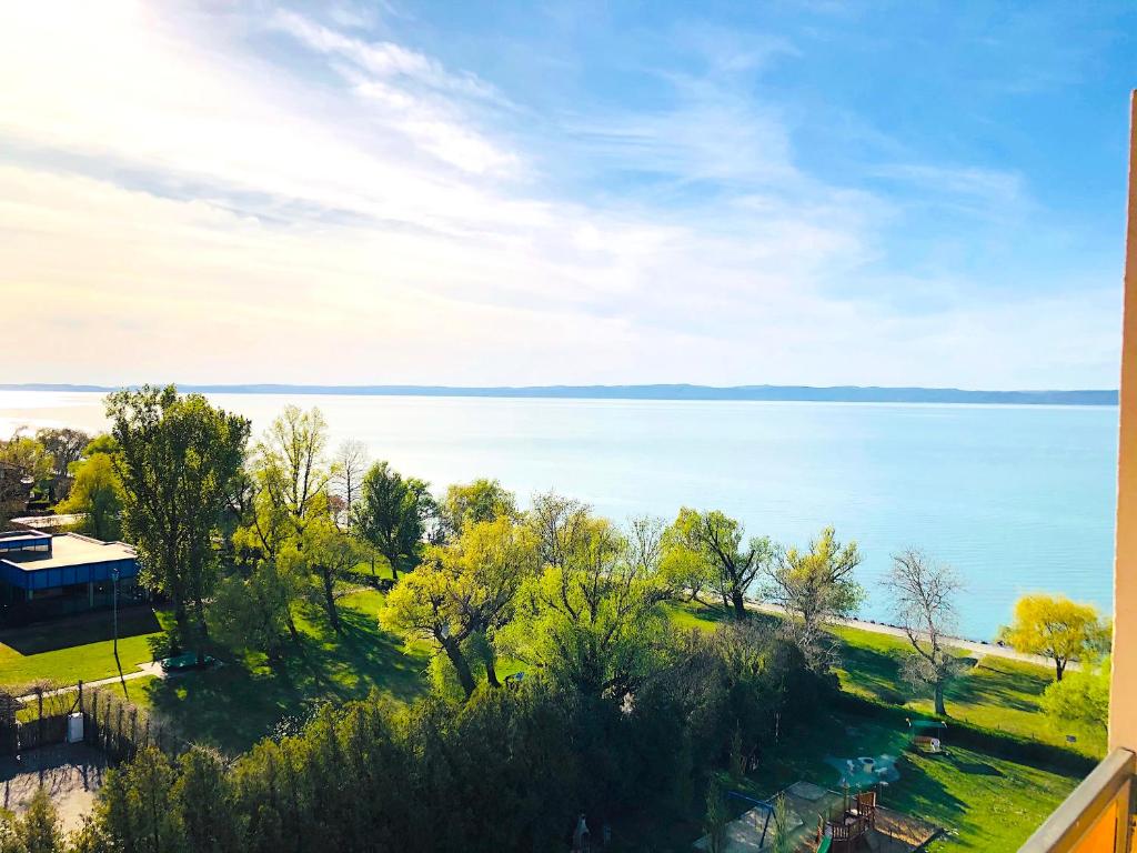 a view of the lake from a house at Aqua Blue Apartmanok - Siófok in Siófok