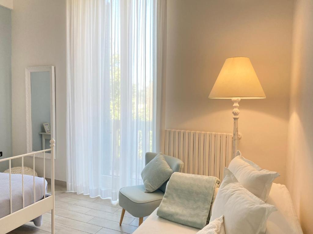 Postel nebo postele na pokoji v ubytování Alla Luce del Barocco