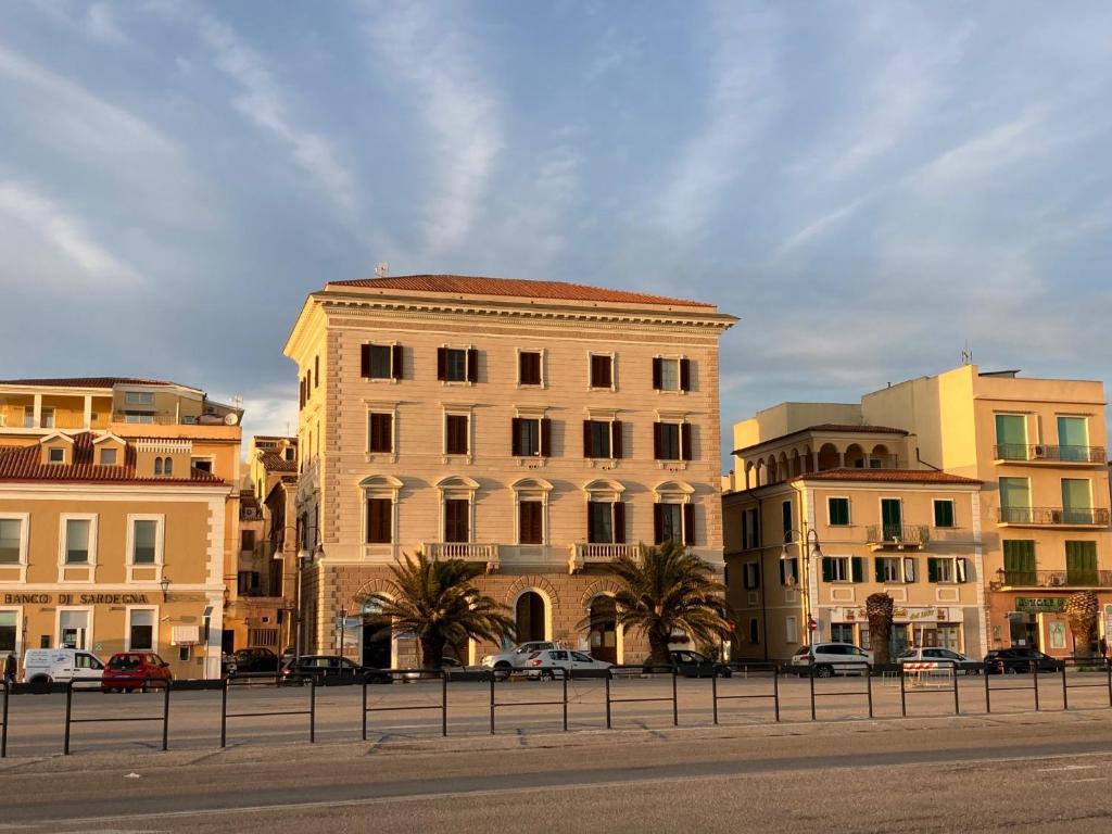 a group of buildings on the side of a street at La Siesta in La Maddalena