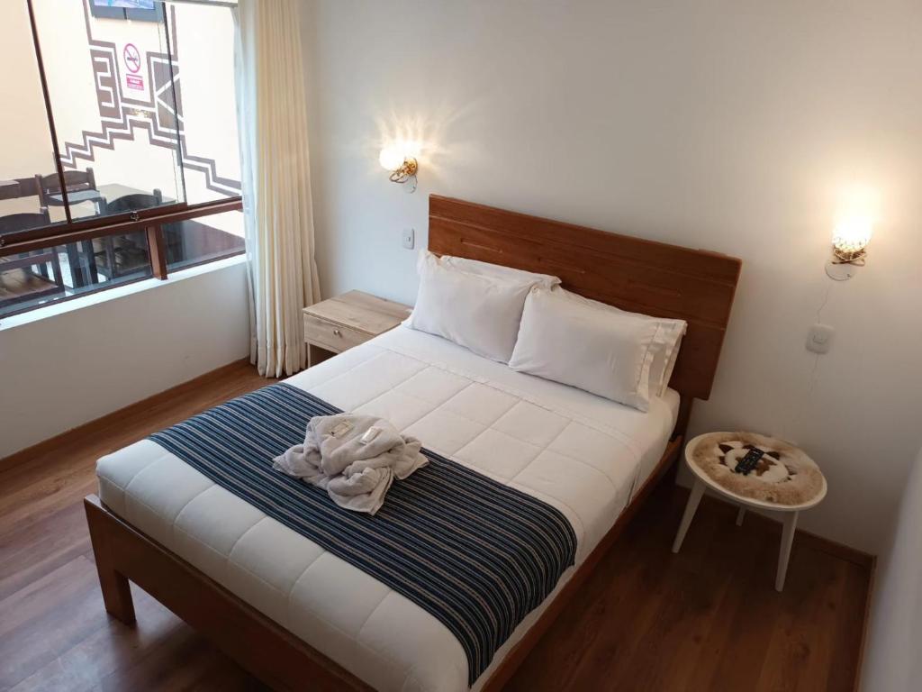 Postel nebo postele na pokoji v ubytování Cusco Hostal Qolla Wasi-II