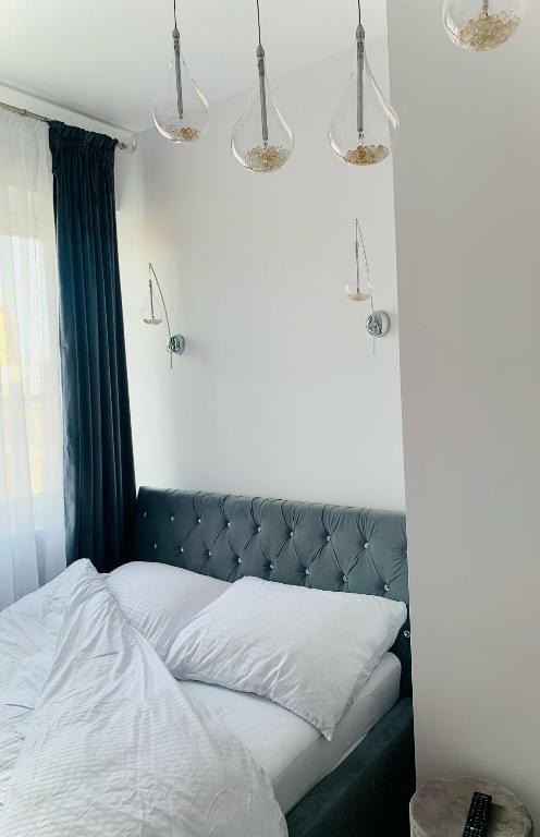 Posteľ alebo postele v izbe v ubytovaní KORONA Apartamenty Gdańsk
