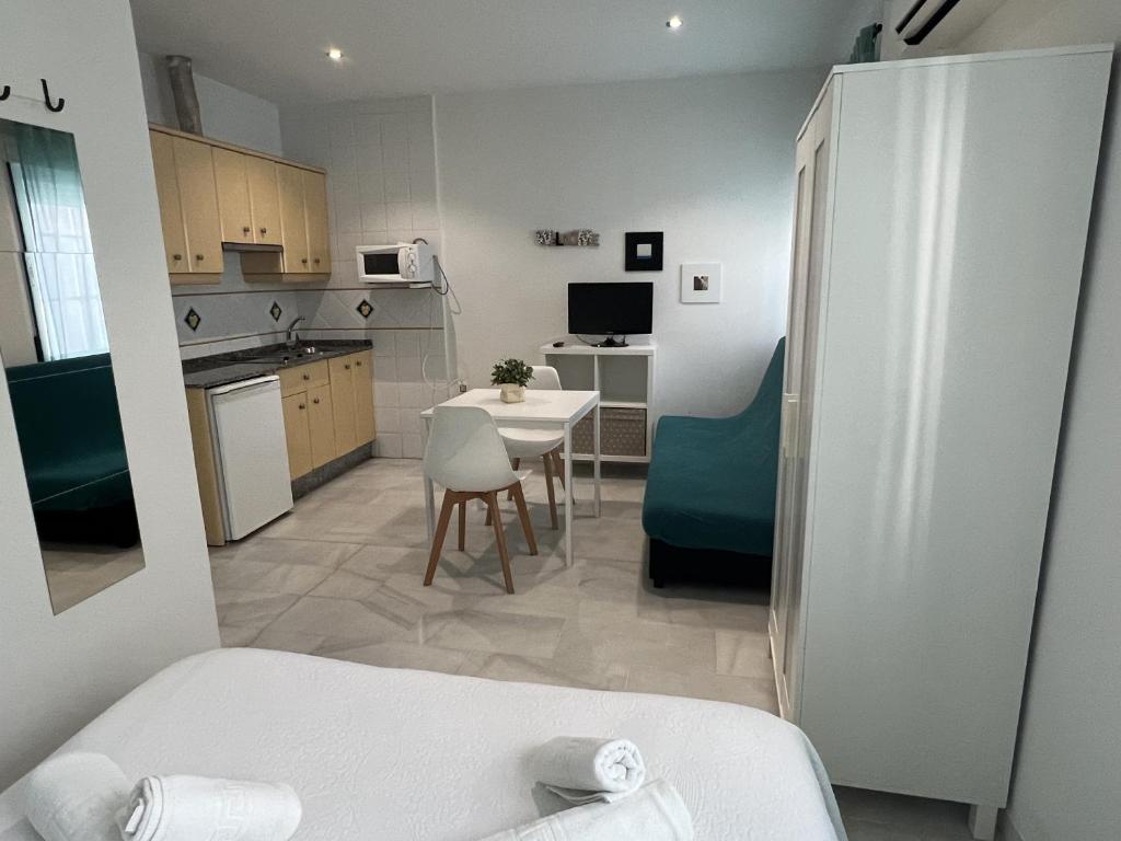 Kuchyň nebo kuchyňský kout v ubytování Apartamentos Ortega