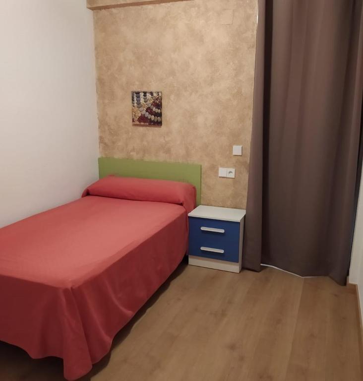 Postel nebo postele na pokoji v ubytování Hostal Rosa