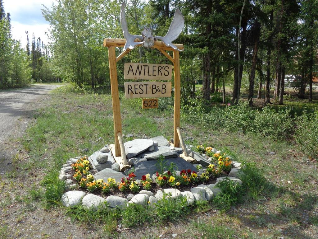 a sign that says animals next to a road at Antler's Rest Bed and Breakfast in Glennallen
