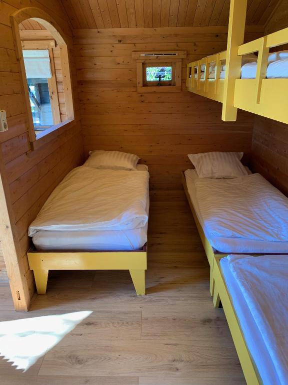 Postel nebo postele na pokoji v ubytování The Bee - Trekkershuts & Apartment
