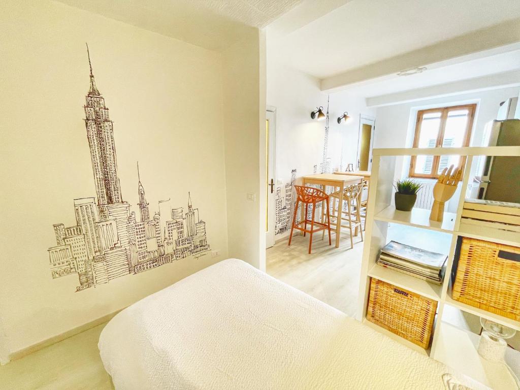 a bedroom with a drawing of a city on the wall at Casa San Lorenzo in Acquapendente