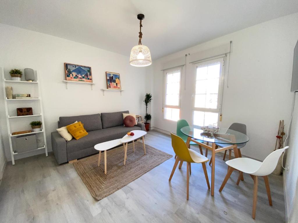 a living room with a couch and a table at MARQUES7HOME in Málaga