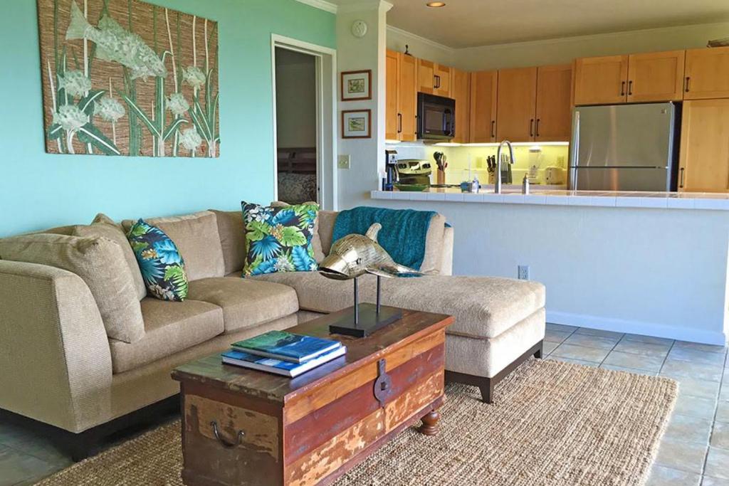 a living room with a couch and a coffee table at Pali Ke Kua 113 in Princeville