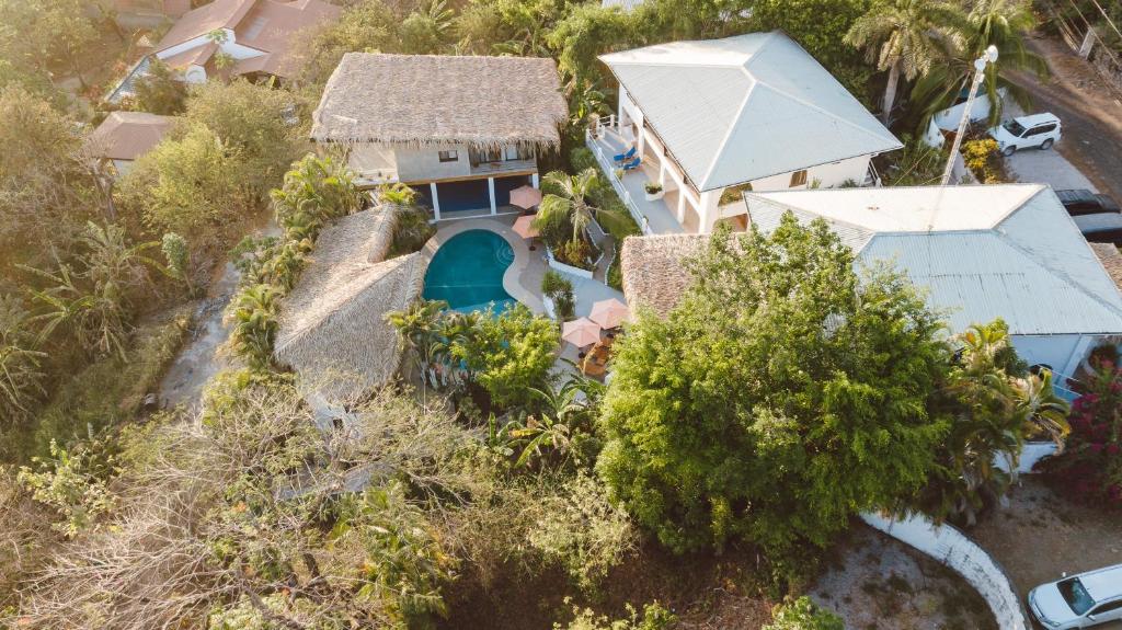 an aerial view of a house with a swimming pool at Casas Kismet in Nosara
