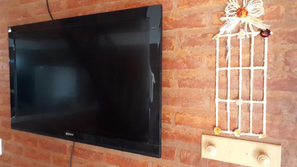 TV a/nebo společenská místnost v ubytování Departamentos Ensueños