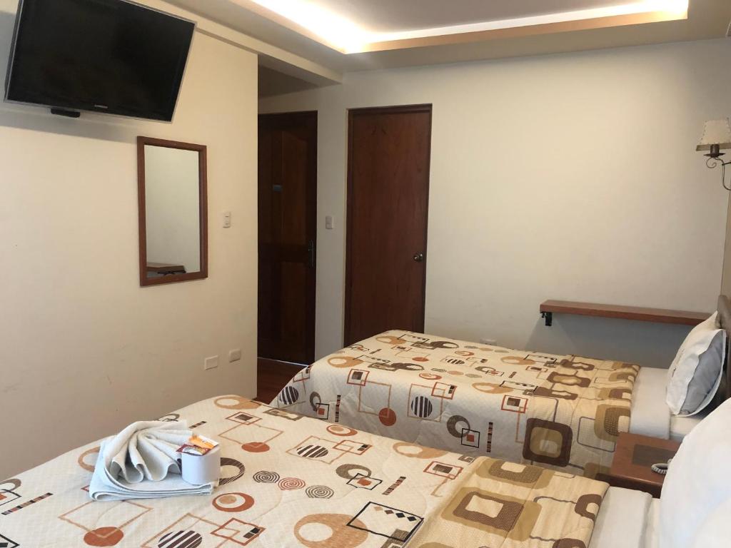 Postel nebo postele na pokoji v ubytování Hotel Imperial