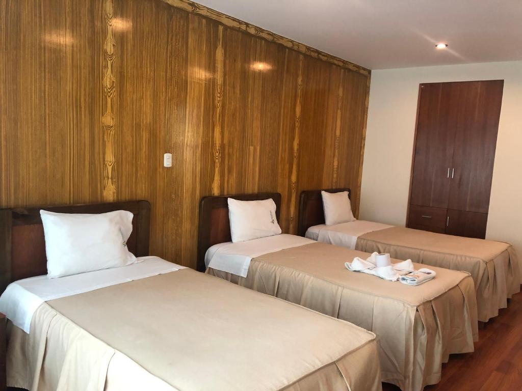 Postel nebo postele na pokoji v ubytování Hotel Imperial