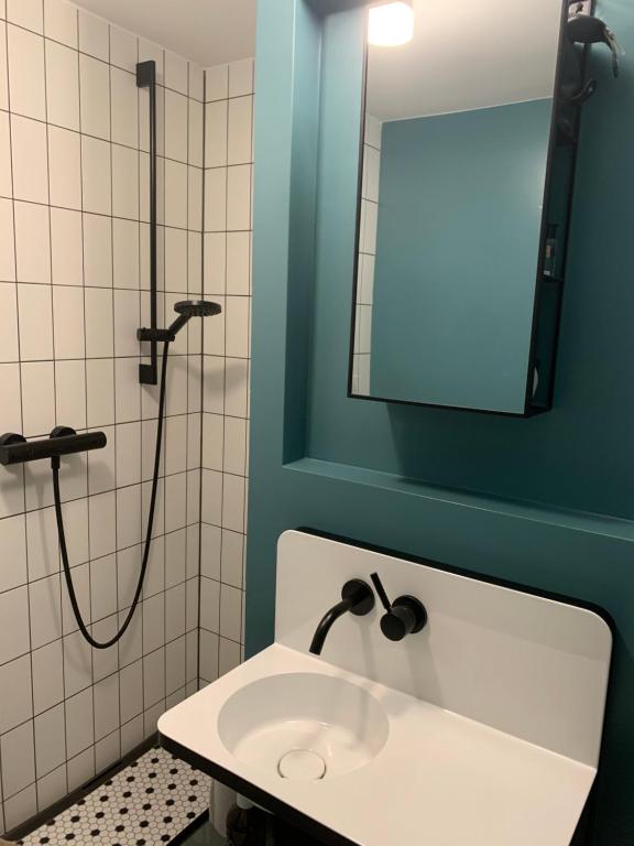 a bathroom with a sink and a shower at Triftbach - View over Zermatt in Zermatt