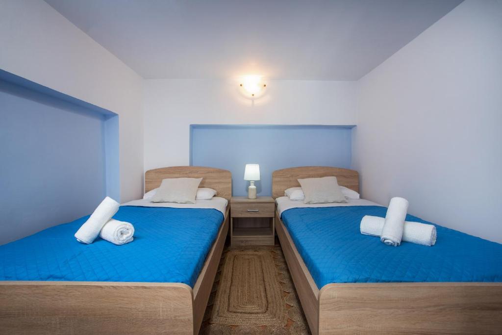 Ένα ή περισσότερα κρεβάτια σε δωμάτιο στο Haraki Bay Loft (by haris)
