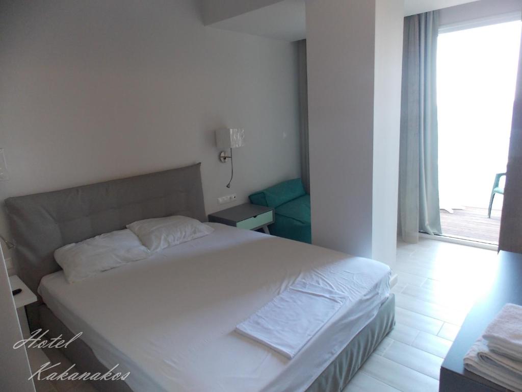Postel nebo postele na pokoji v ubytování Hotel Kakanakos