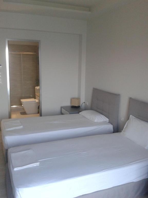 Postel nebo postele na pokoji v ubytování Hotel Kakanakos