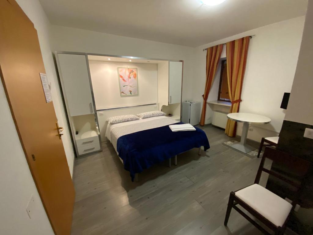 Postel nebo postele na pokoji v ubytování Colle Sul Lago