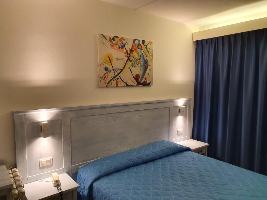 Postel nebo postele na pokoji v ubytování Hotel Le Tre Isole