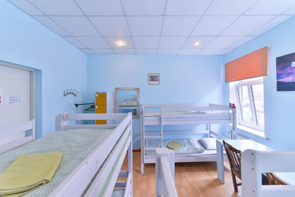 Postel nebo postele na pokoji v ubytování Central Hostel