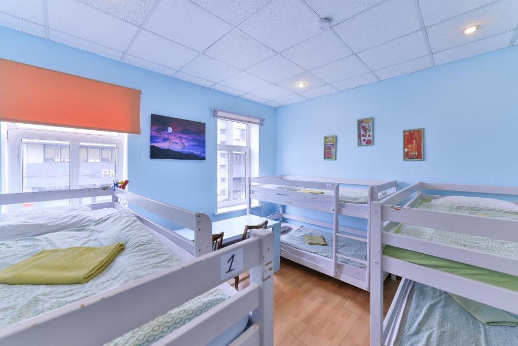 Postel nebo postele na pokoji v ubytování Central Hostel