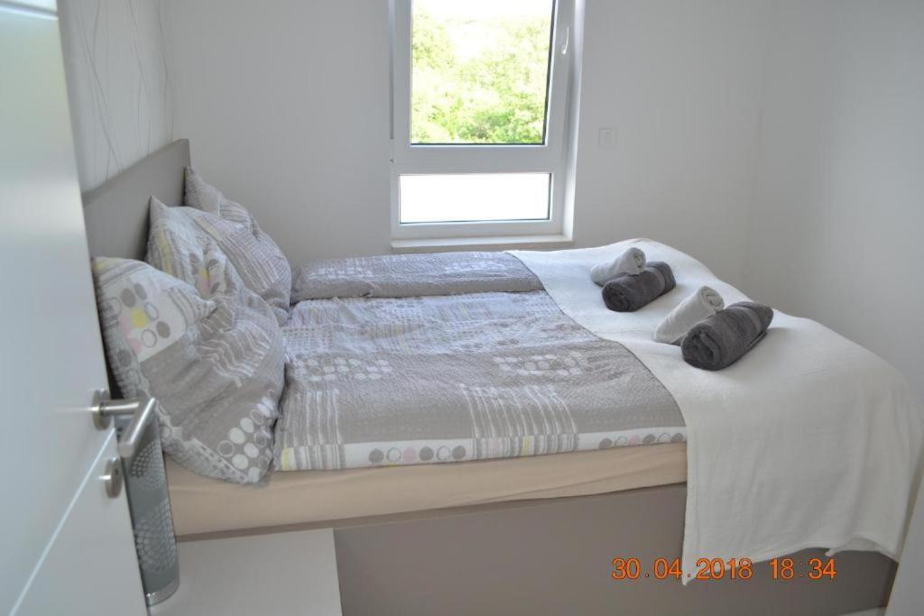 Posteľ alebo postele v izbe v ubytovaní My Paradies - Njivice Penthouse***