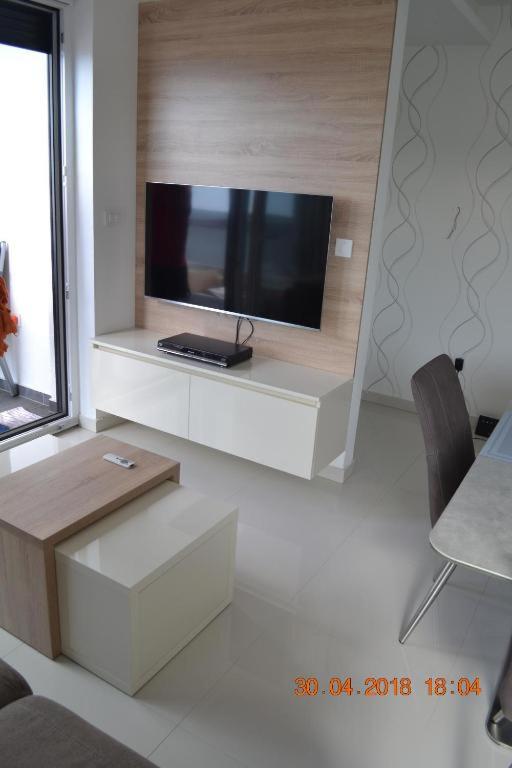 Televízia a/alebo spoločenská miestnosť v ubytovaní My Paradies - Njivice Penthouse***