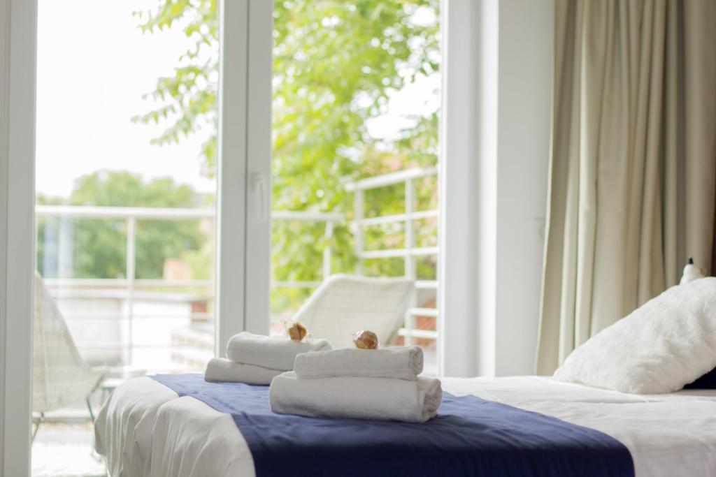 Postel nebo postele na pokoji v ubytování Hotel Aan Zee