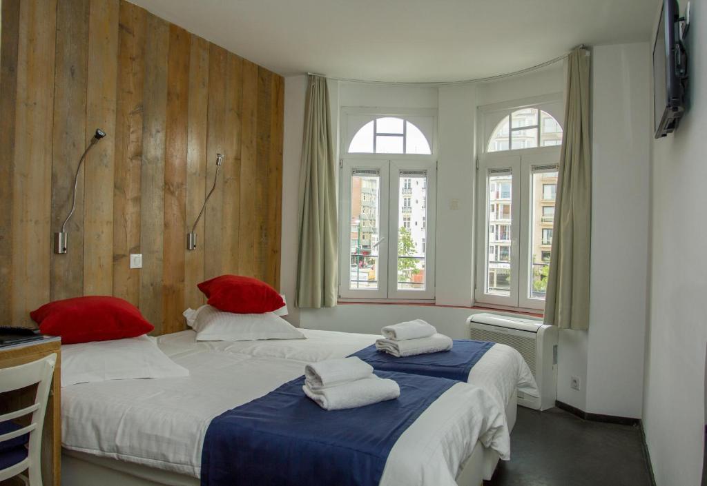 Postel nebo postele na pokoji v ubytování Hotel Aan Zee
