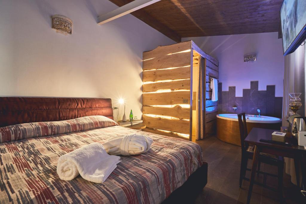 Postel nebo postele na pokoji v ubytování Le Stagioni Luxury Suite