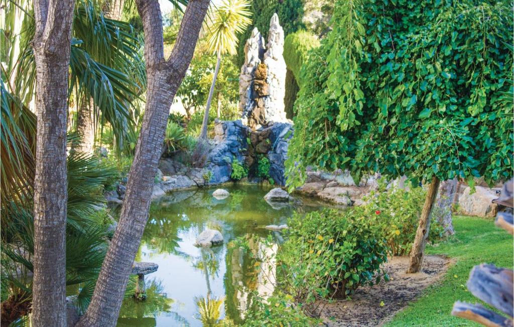A garden outside 2 Bedroom Awesome Apartment In Mijas