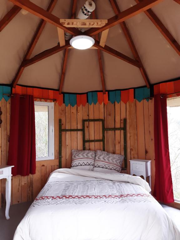 Postel nebo postele na pokoji v ubytování LA HUTTE MASSAÏ