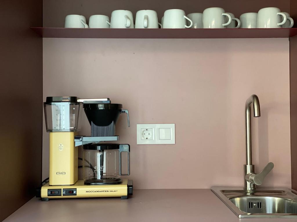 Příslušenství pro přípravu čaje a kávy v ubytování Isabella Living