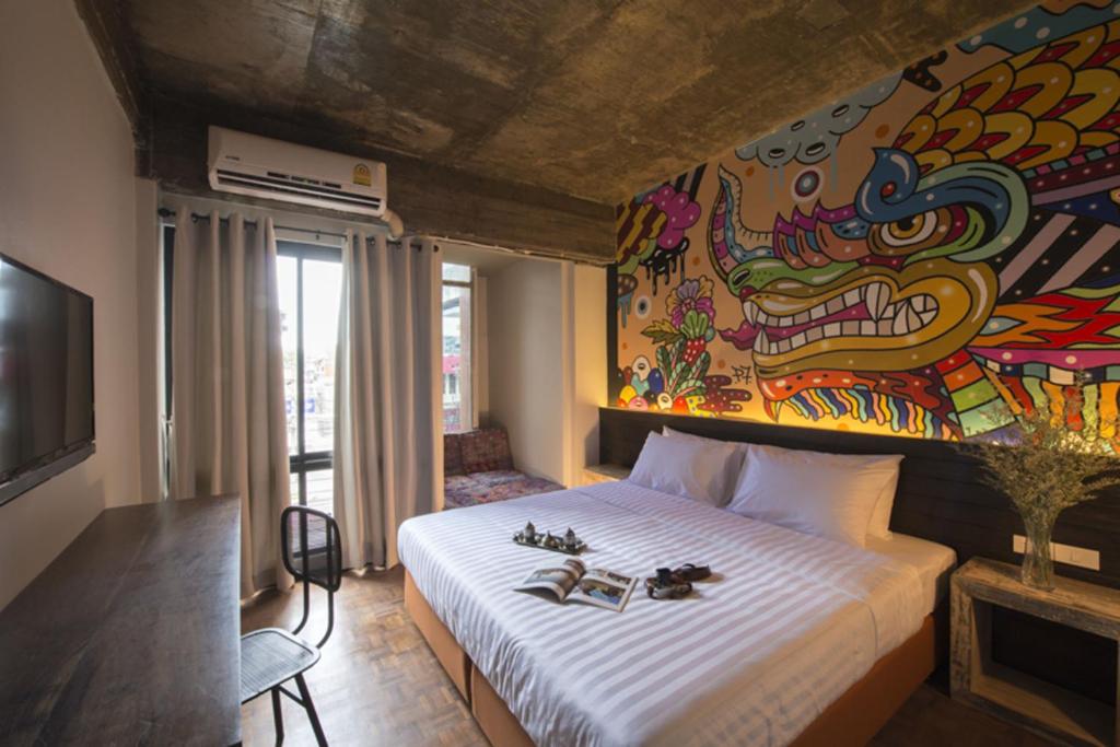 Postel nebo postele na pokoji v ubytování Cacha Hotel