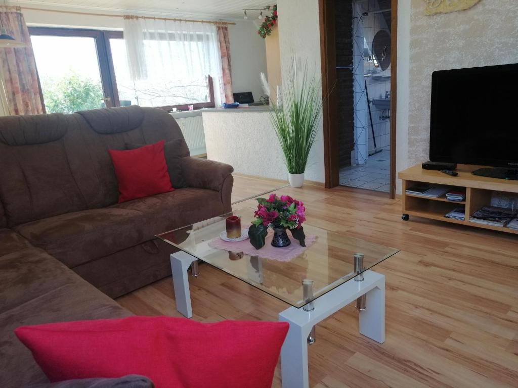 a living room with a couch and a coffee table at Haus Weda in Krummhörn