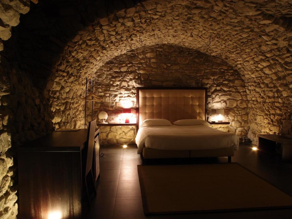 Postel nebo postele na pokoji v ubytování Hotel Corte Santa Libera